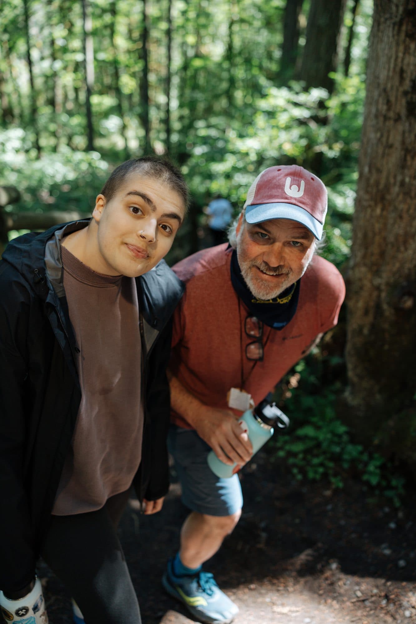 Two people smiling together outdoors